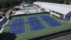 Commercial fitness center design of outdoor tennis courts and pool at the Weymouth Club in Massachusetts.