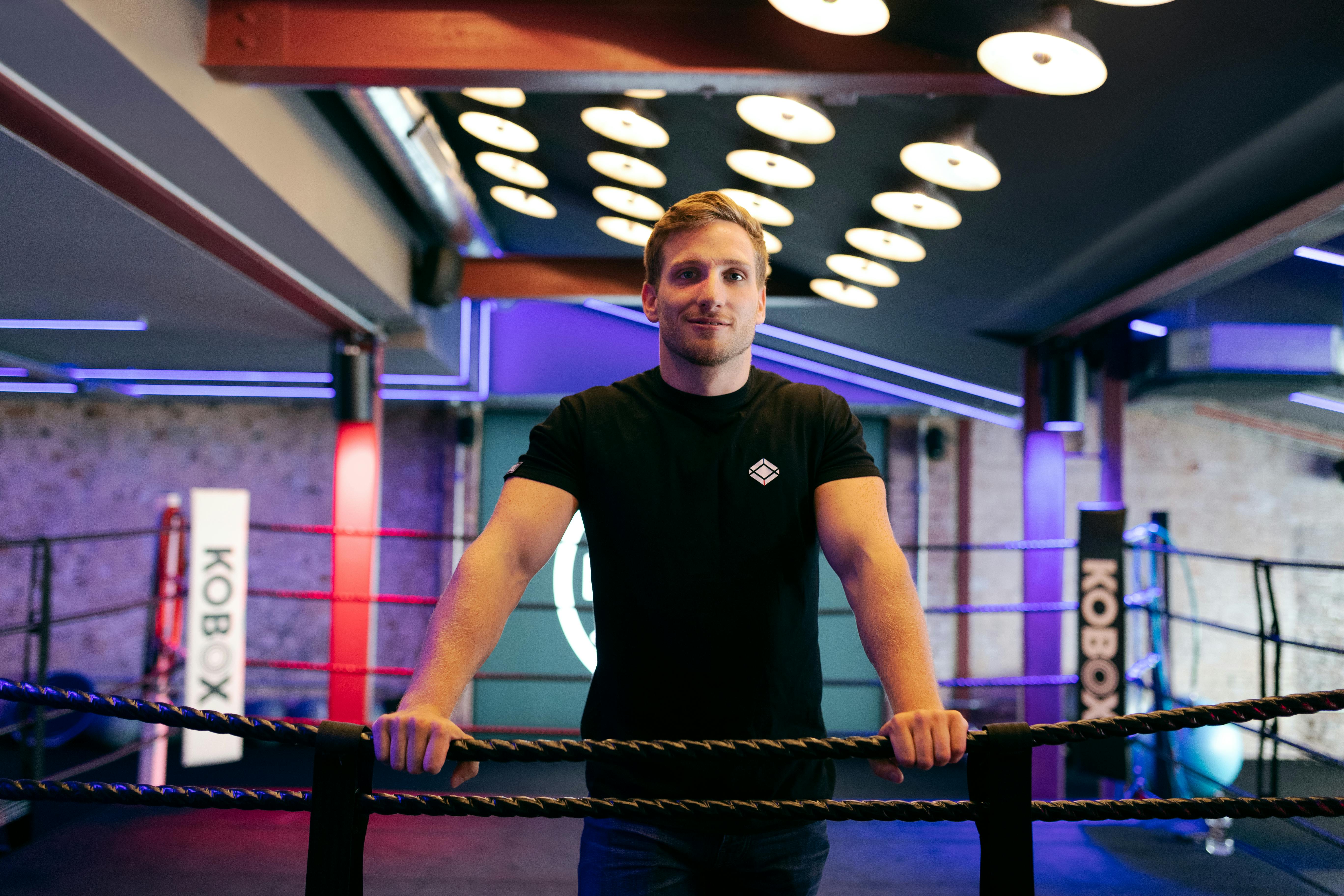 man in boxing ring with led lighting